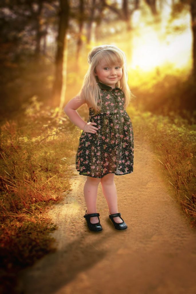 The daughter of the Intended Parent in a flowered dress.